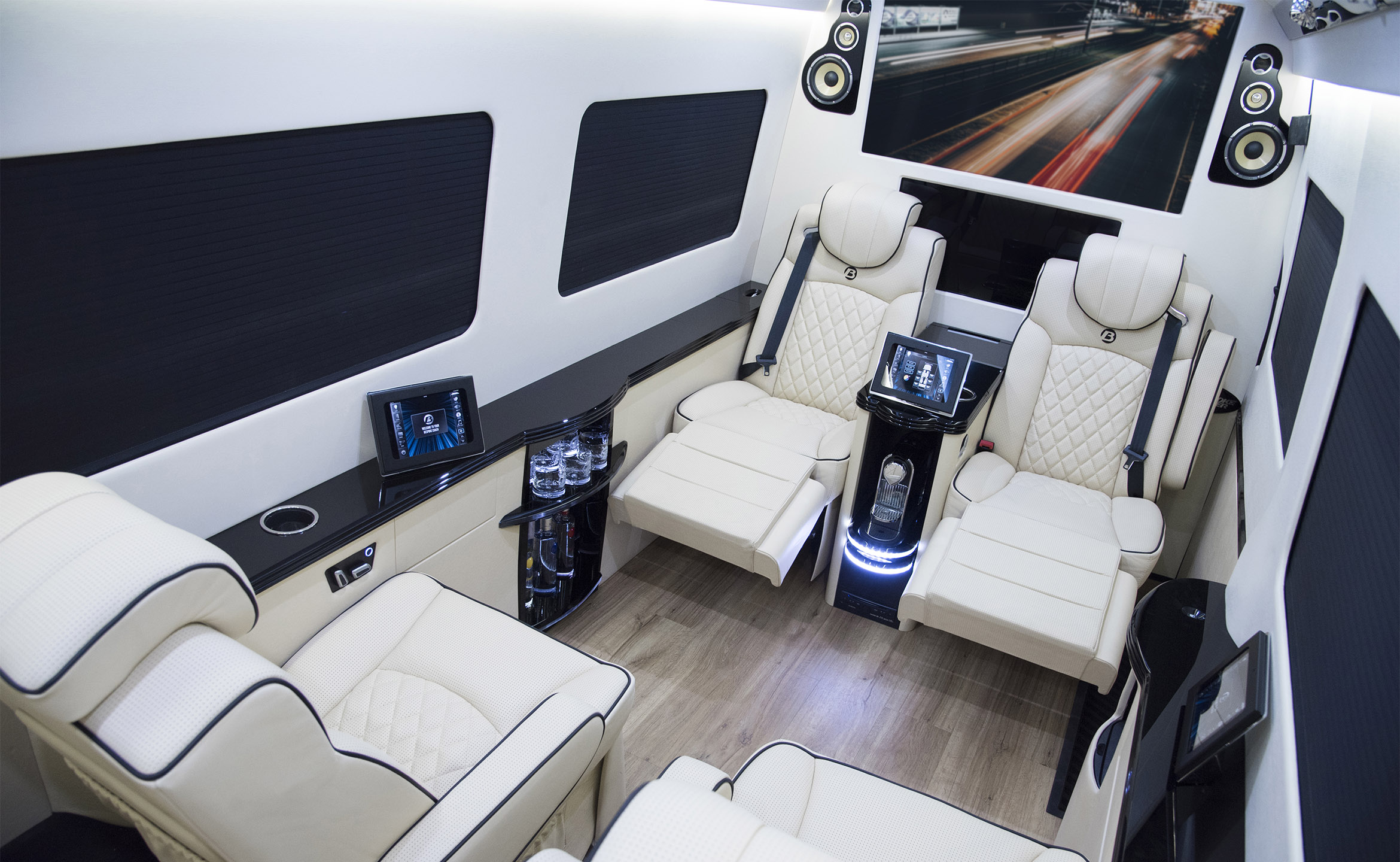 Bespoke Coach luxury Sprinter van rear lounge interior