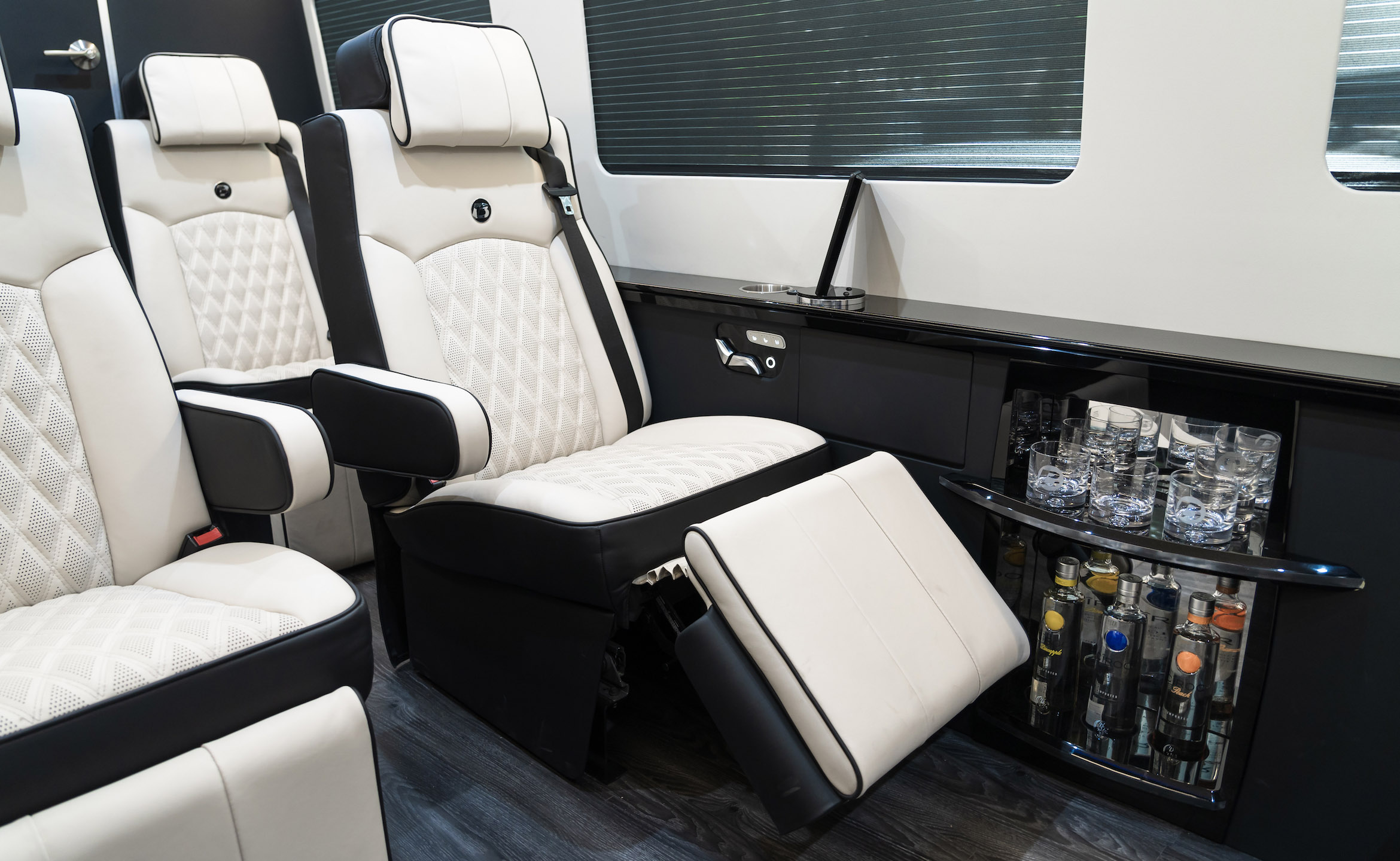Custom Interior Bespoke Mercedes Benz Luxury Sprinter Van Conversion, Bathroom, & Luxury Mobile Offices.
